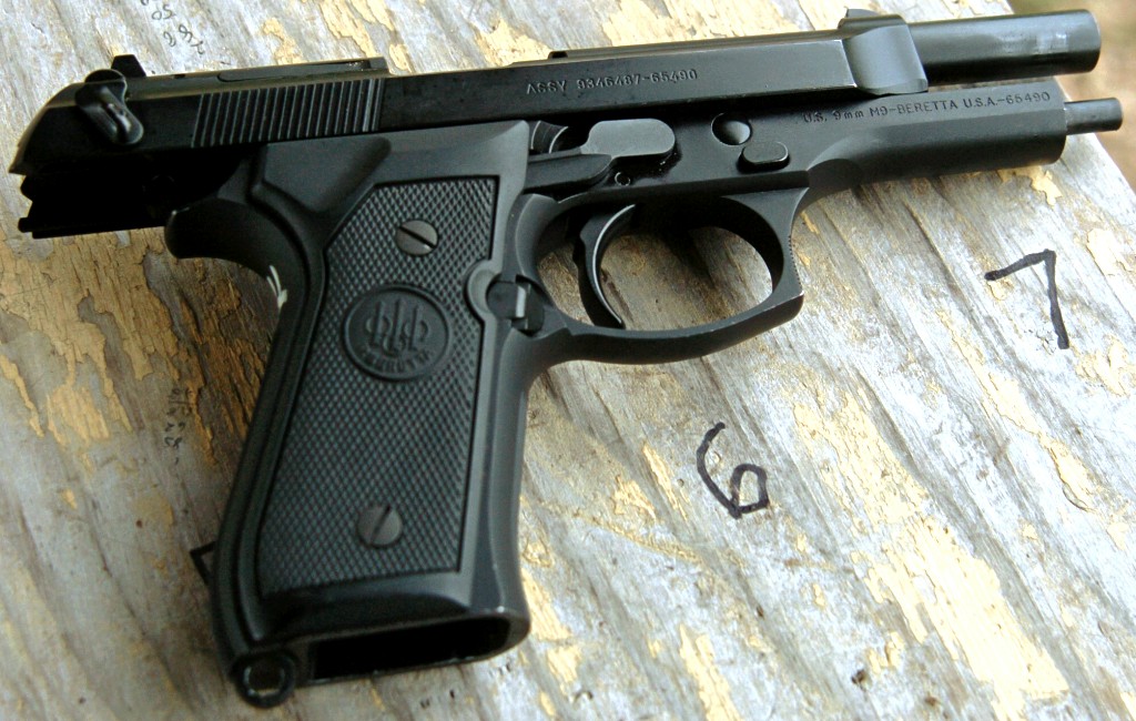 9mm pistol on bed